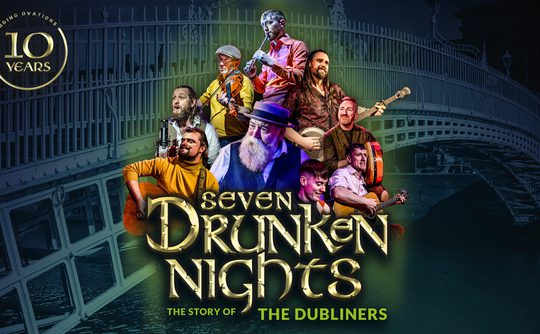 Collage of musicians playing instruments in colorful attire, set against an iconic bridge. Text reads: 'Seven Drunken Nights: The Story of The Dubliners' and a '10 Years' emblem. Energetic and celebratory mood.