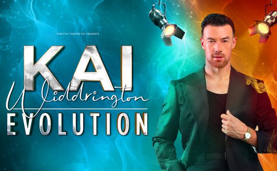 A man in a black suit stands confidently against a vibrant background of swirling blue and orange light. Bold text reads "Kai Widdrington Evolution." Spotlights shine above.