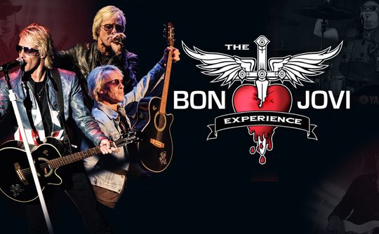 Three musicians with guitars perform energetically on stage, highlighted against a dark background. The text reads 'The Bon Jovi Experience' with a heart and sword logo, suggesting a rock concert vibe.