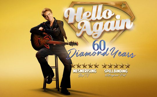 A person with a guitar sits on a stool against a yellow background. Text reads "Hello Again, 60 Diamond Years" with star ratings and reviews.