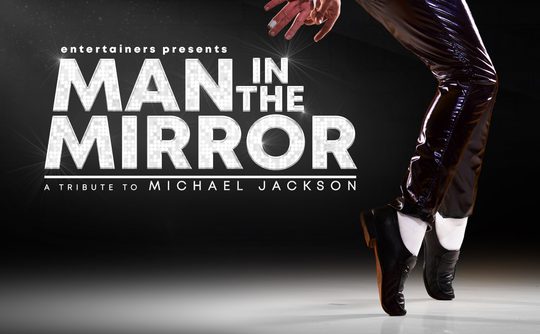 Silhouette of a dancer in shiny pants and black shoes mid-dance, with 'Man in the Mirror: A Tribute to Michael Jackson' in bold text.