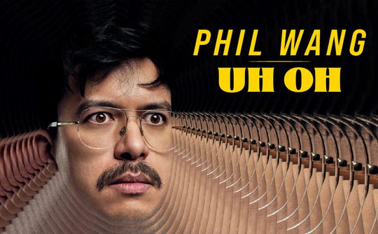A man's face with glasses and a moustache appears in a surreal, mirrored pattern. Bold yellow text reads "Phil Wang Uh Oh." The tone is intriguing and thought-provoking.