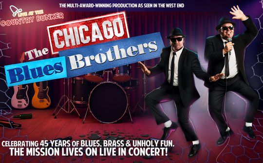 Poster for "The Chicago Blues Brothers" show, featuring two performers in black suits and sunglasses. Background shows guitars and drums on stage. Energetic and upbeat.