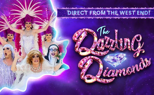 Drag queens in sparkling costumes and feathers pose joyfully on a purple background. Text reads "The Dazzling Diamonds" with a diamond graphic.