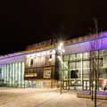 The Cast building at night, wide angle shot with purple Cast logo lighting